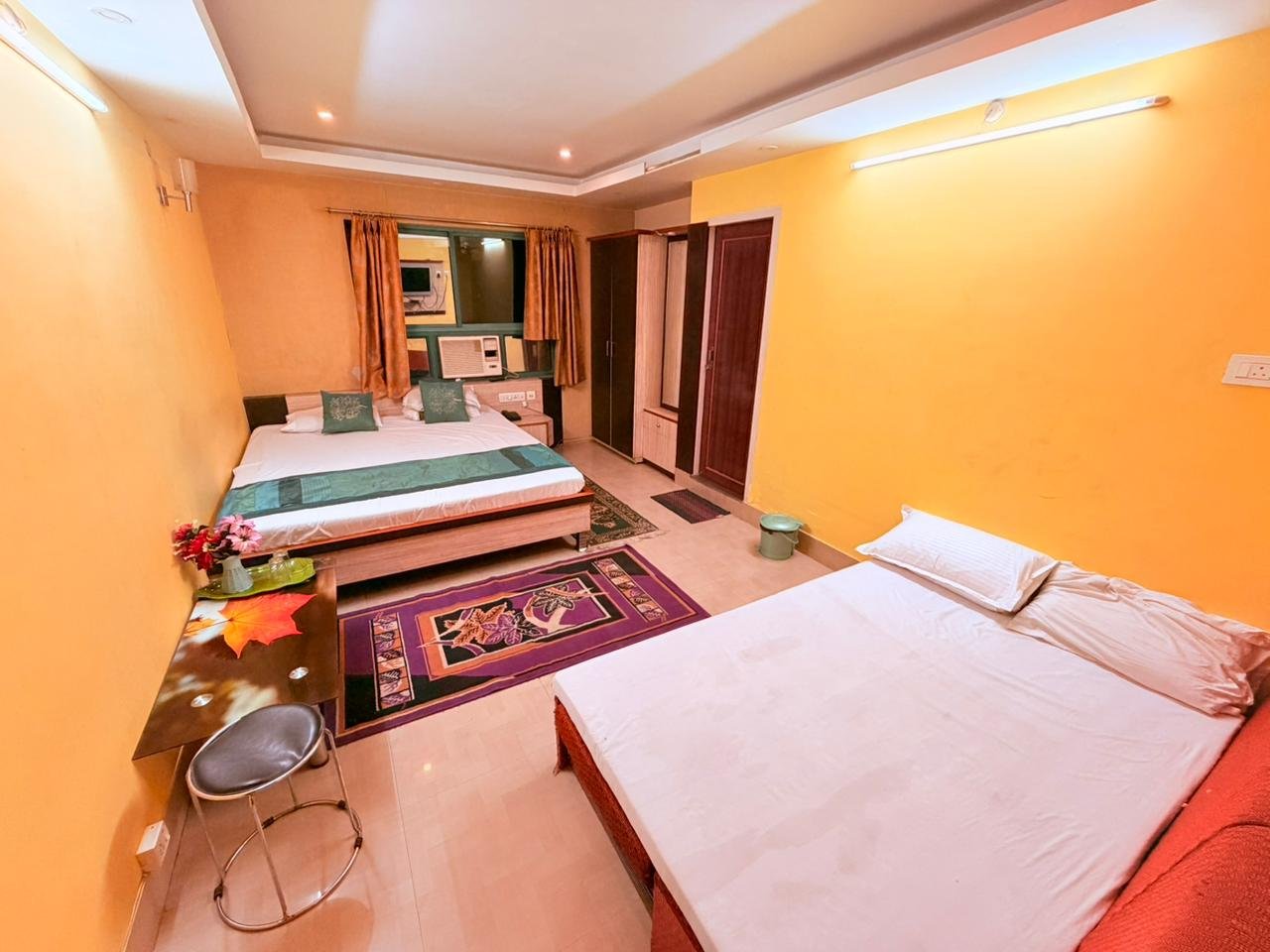 Large room with a double bed and an additional bed